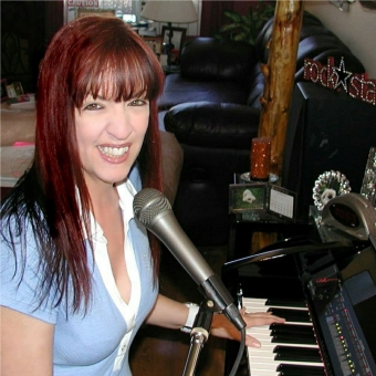 Music by Melissa Voice and Piano Lessons  Logo